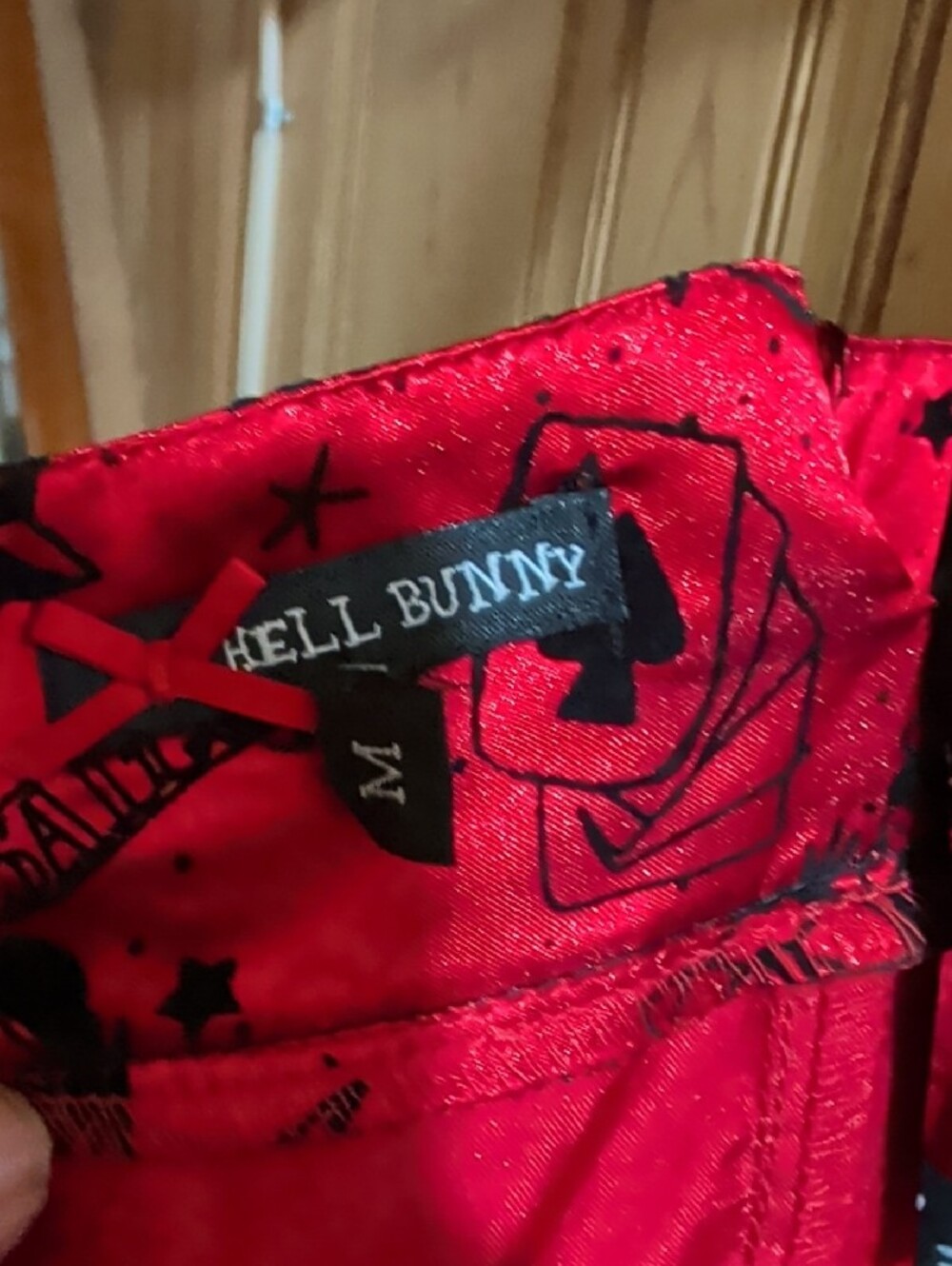 Hell Bunny Red Satin High-Low Dress with Black Trim and Bow Accents - Picture 6 of 9